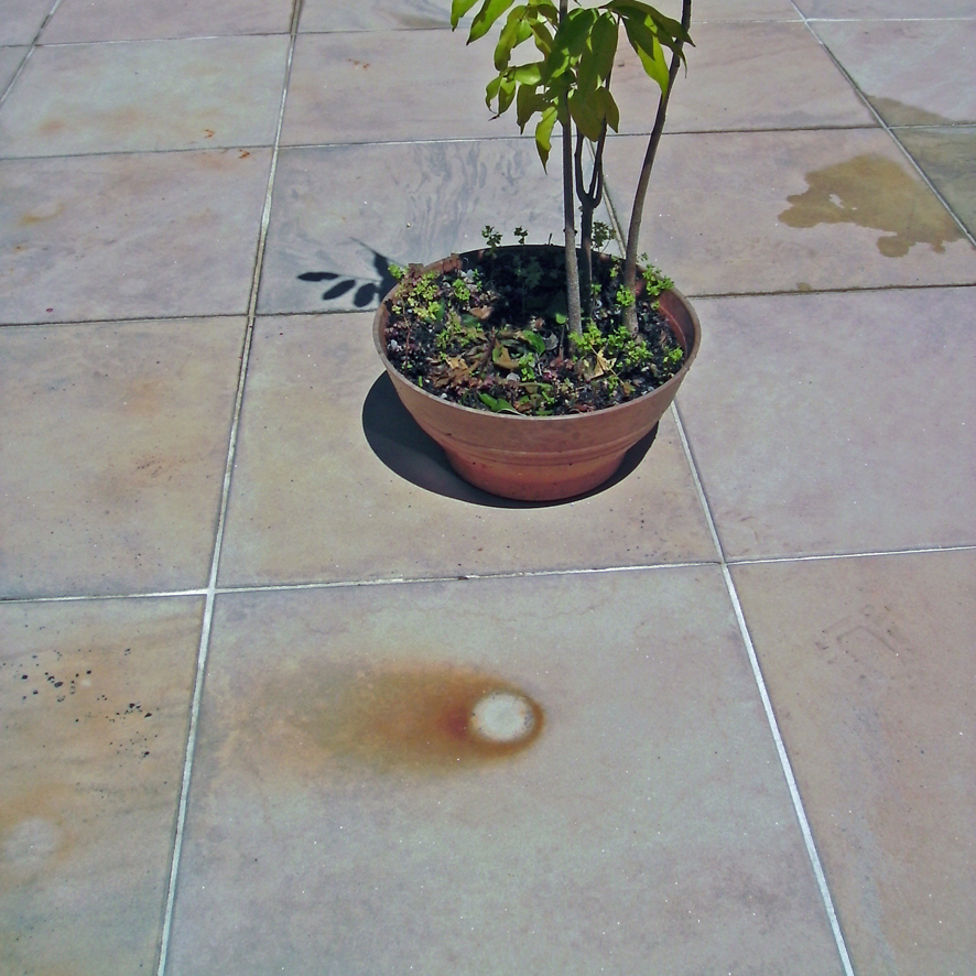 rust marks on tiles, rust on stone, before tile cleaning